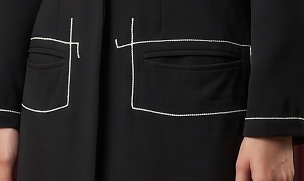 Close-up of welt pockets with contrast topstitching on The Line blazer